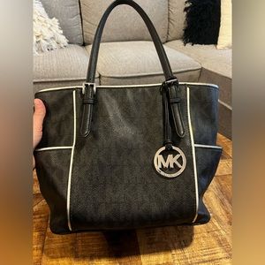 Michael Kors Black and Silver MK Purse with pockets on the side